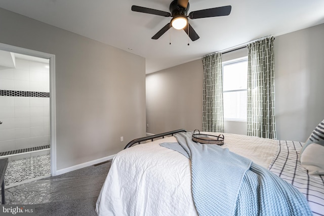 bedroom featuring ceiling fan, ensuite bath, visible vents, and baseboards