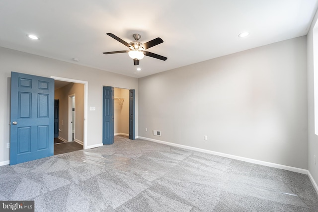 unfurnished bedroom featuring recessed lighting, carpet flooring, and baseboards