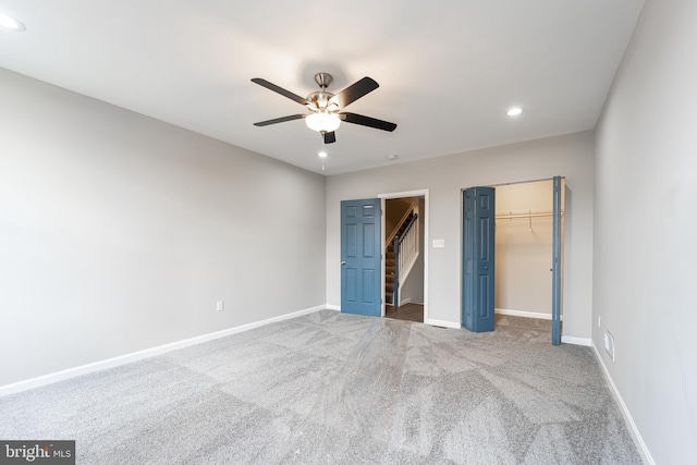 unfurnished bedroom featuring recessed lighting, a closet, carpet flooring, ceiling fan, and baseboards