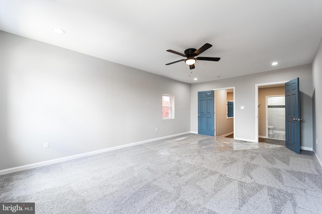 unfurnished bedroom featuring recessed lighting, a ceiling fan, baseboards, a spacious closet, and carpet