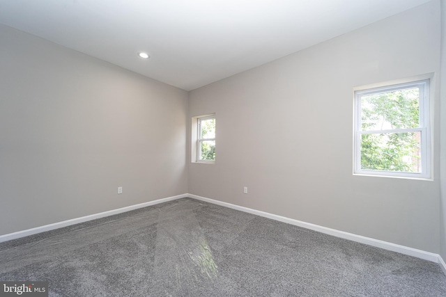 unfurnished room with recessed lighting, carpet flooring, and baseboards