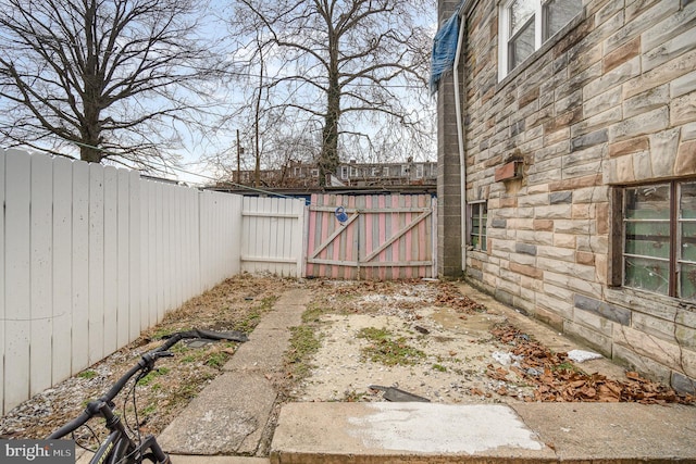 view of gate with fence