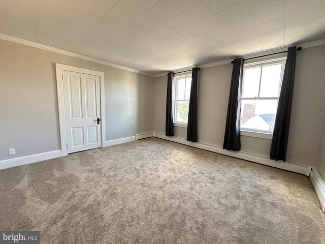 unfurnished room featuring a baseboard radiator, baseboards, carpet, and crown molding