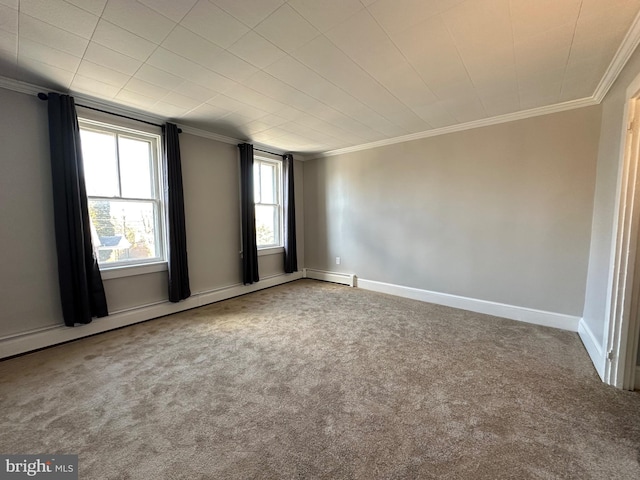 carpeted spare room with a baseboard radiator, baseboards, and ornamental molding