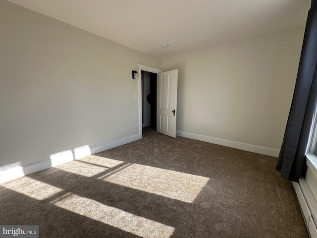 unfurnished bedroom with baseboards and carpet floors