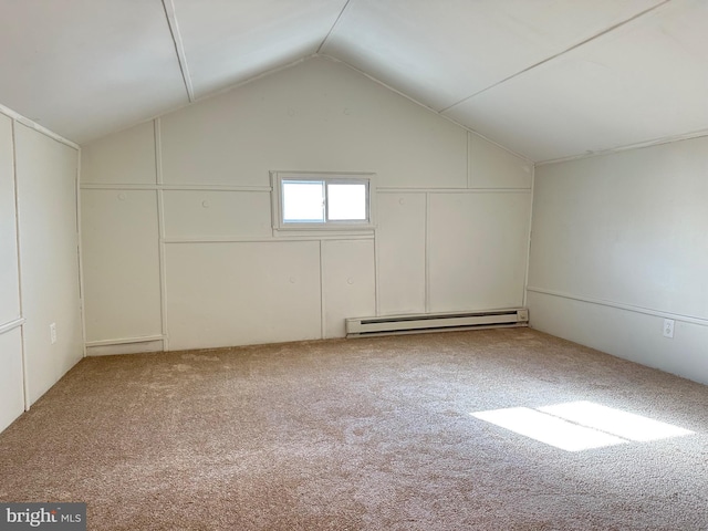 bonus room with a baseboard heating unit, carpet, and vaulted ceiling