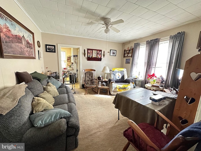 carpeted living area featuring ceiling fan