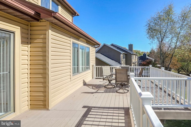 wooden deck featuring outdoor dining space