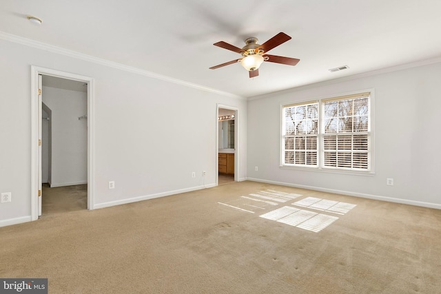 unfurnished bedroom featuring baseboards, visible vents, and crown molding