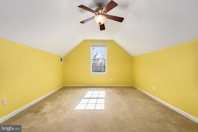 bonus room with lofted ceiling, carpet flooring, and baseboards