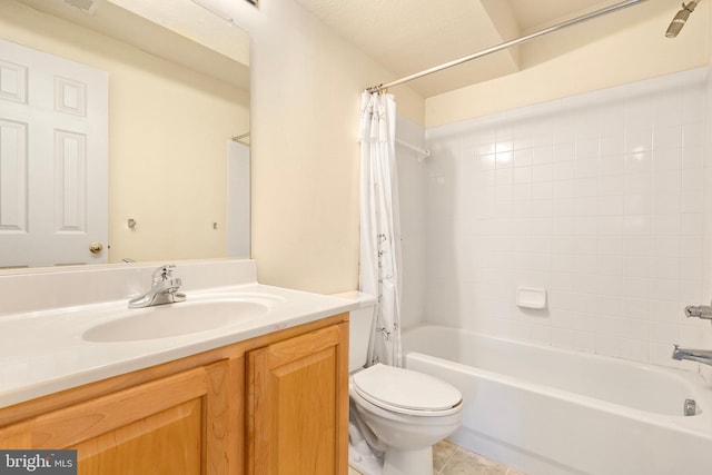 bathroom featuring shower / bath combo, vanity, toilet, and tile patterned floors