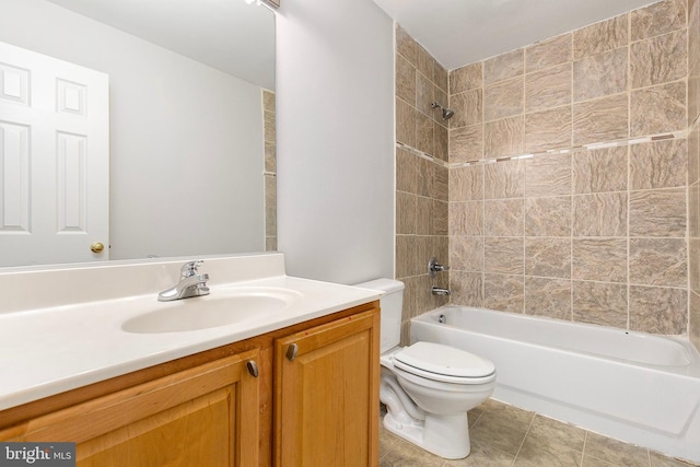 bathroom featuring shower / bathing tub combination, vanity, toilet, and tile patterned floors