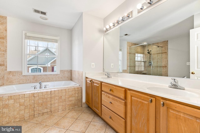 full bath featuring a shower stall, visible vents, a sink, and tile patterned floors