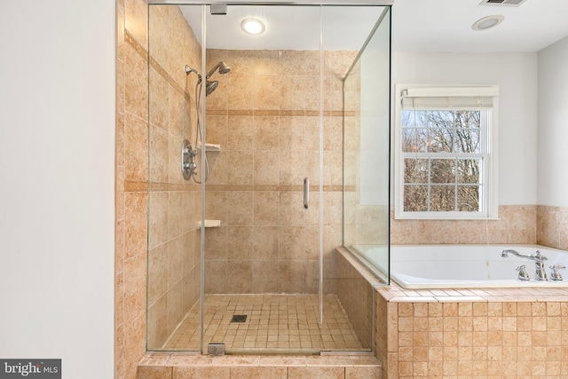 full bath featuring visible vents, a shower stall, and a bath