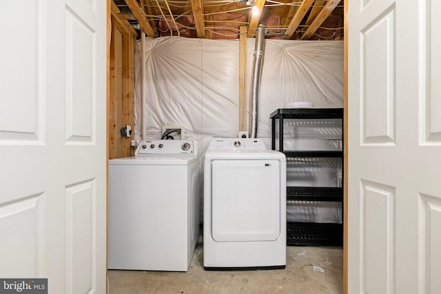 laundry area with washing machine and clothes dryer