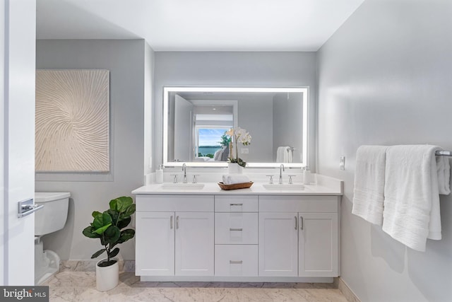 bathroom with double vanity and a sink