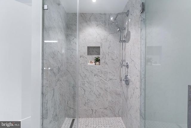 full bath featuring a shower stall