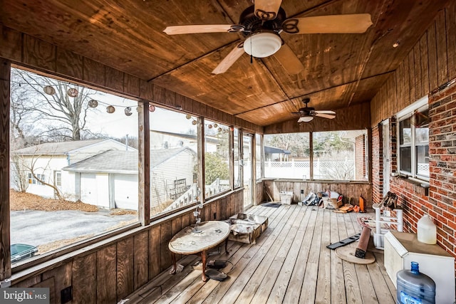 sunroom with wooden ceiling and ceiling fan