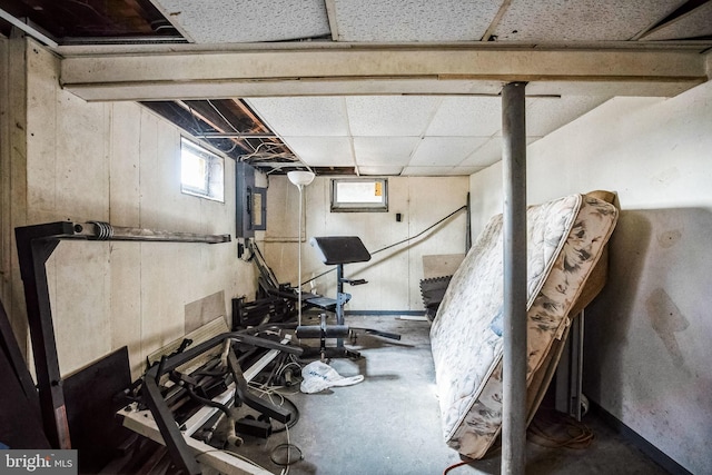 workout area featuring a drop ceiling