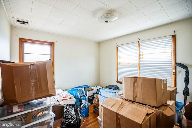 interior space with visible vents and wood finished floors