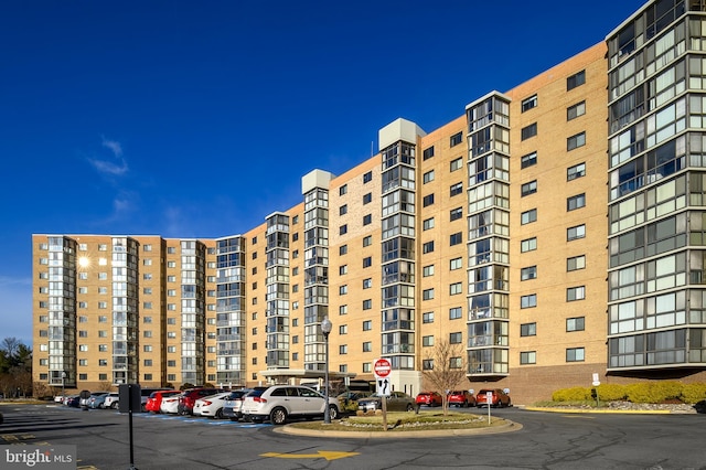 view of property featuring uncovered parking