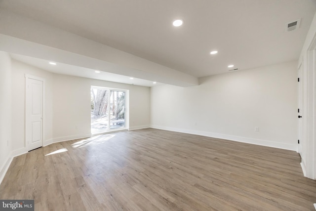 interior space featuring light wood-style flooring, visible vents, baseboards, and recessed lighting