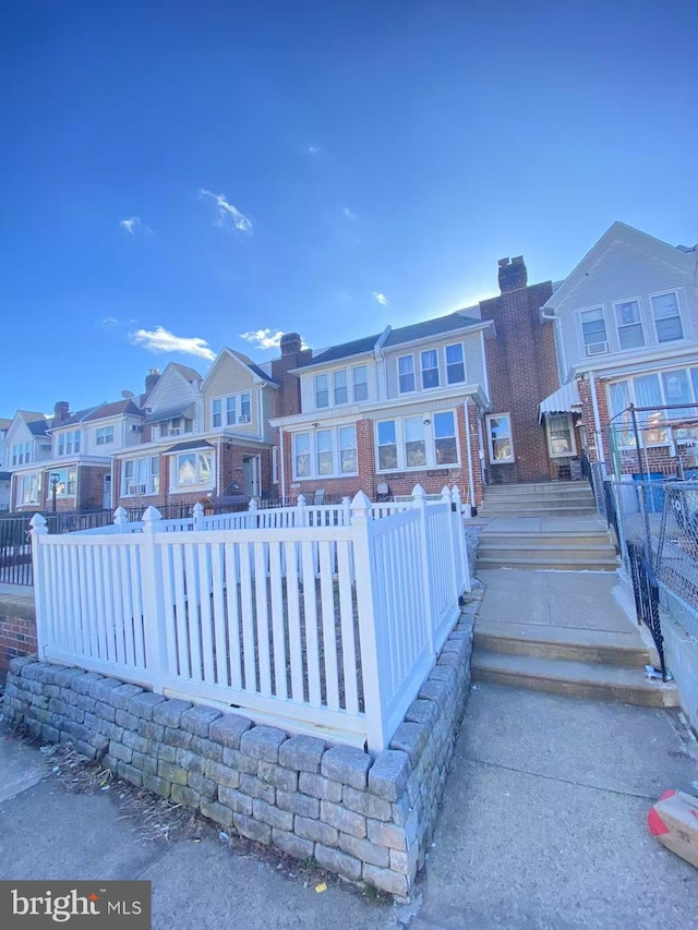 exterior space with a residential view and fence