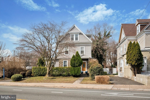 view of front of home with stone siding