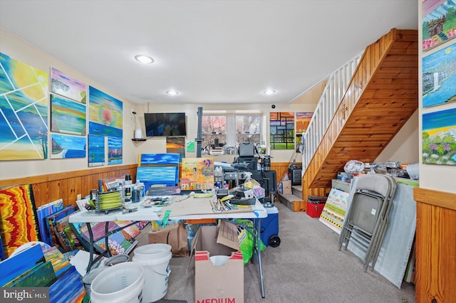 office featuring recessed lighting, carpet flooring, wainscoting, and wood walls