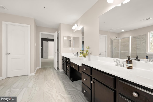 full bathroom with a stall shower, a sink, and visible vents