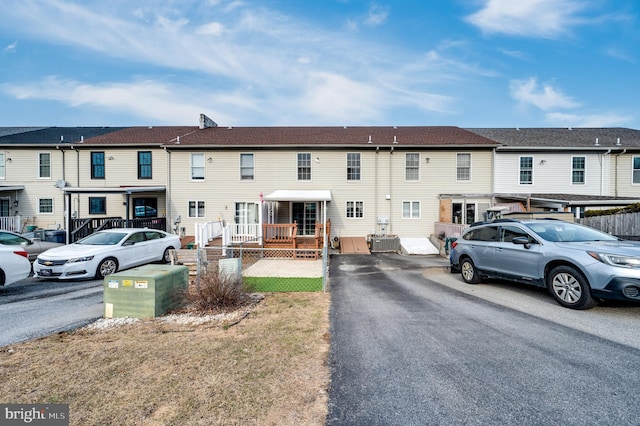 view of front facade with a residential view and cooling unit