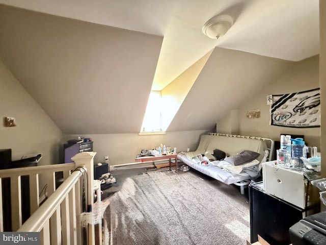 bedroom featuring carpet floors and vaulted ceiling