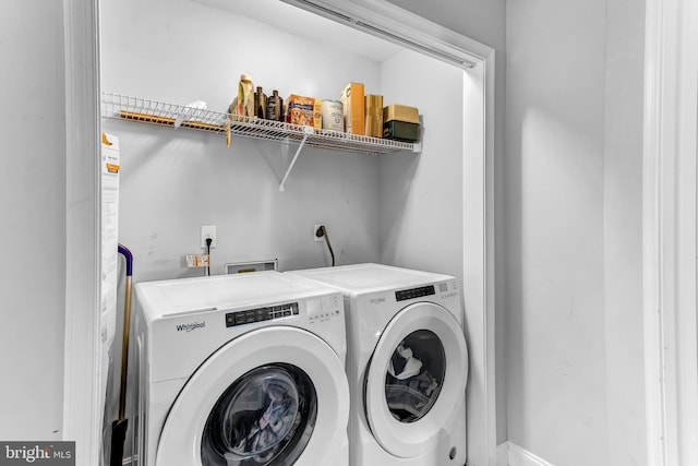 laundry area with laundry area and separate washer and dryer