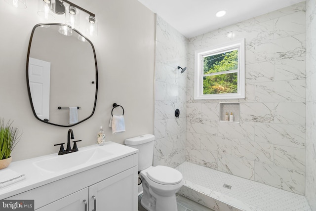 full bath featuring toilet, a stall shower, recessed lighting, and vanity