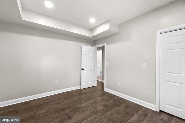 unfurnished bedroom featuring dark wood-style floors, recessed lighting, and baseboards