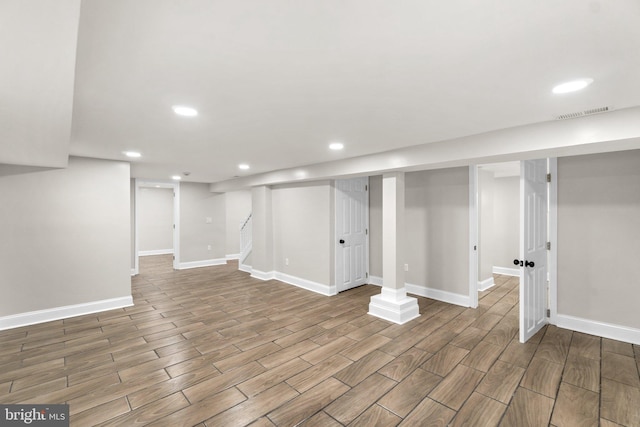 finished basement with baseboards and wood tiled floor