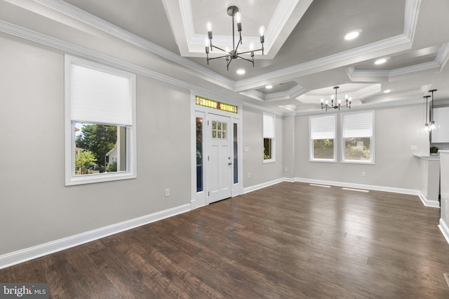 unfurnished living room with ornamental molding, dark wood-style floors, and an inviting chandelier