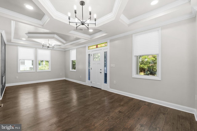 entrance foyer with a healthy amount of sunlight, an inviting chandelier, and crown molding