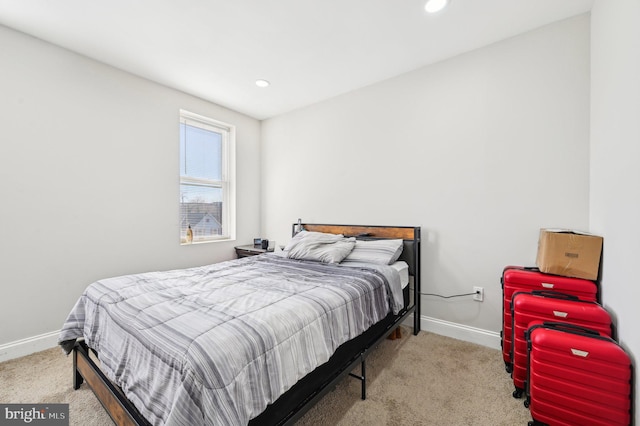 carpeted bedroom featuring recessed lighting and baseboards