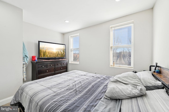 bedroom featuring recessed lighting and baseboards