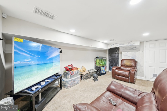 carpeted living area with visible vents and recessed lighting