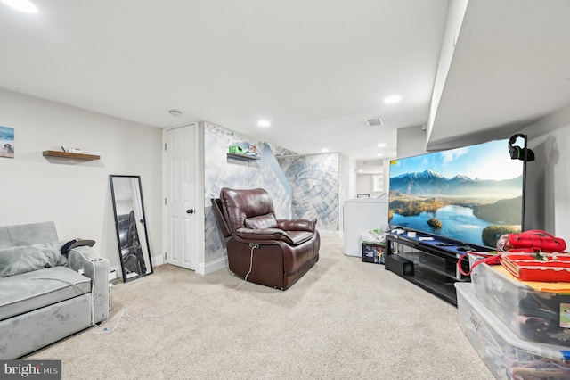 carpeted living area with visible vents, recessed lighting, and baseboards