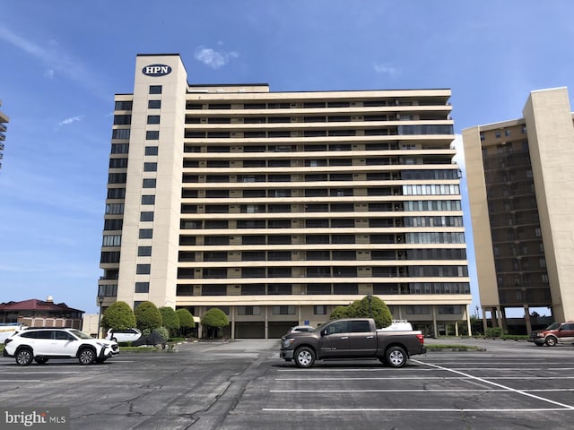 view of property featuring uncovered parking