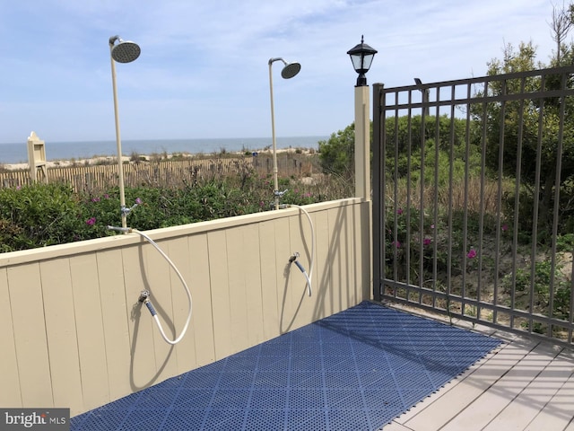 wooden deck with a water view