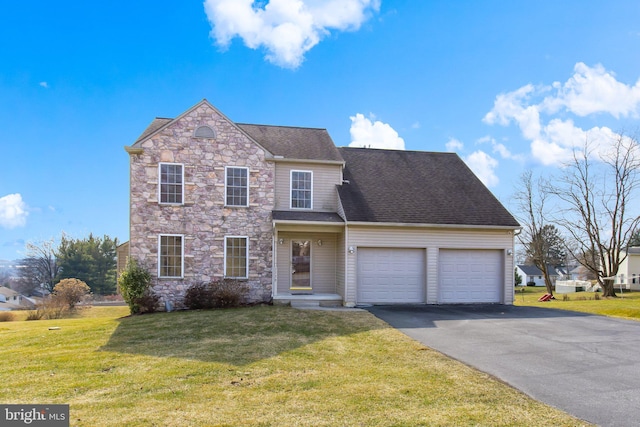 traditional-style home featuring an attached garage, driveway, stone siding, roof with shingles, and a front yard