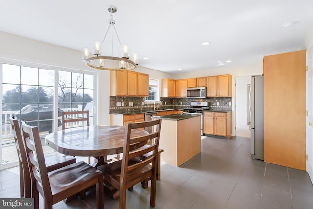 dining space featuring a chandelier and recessed lighting