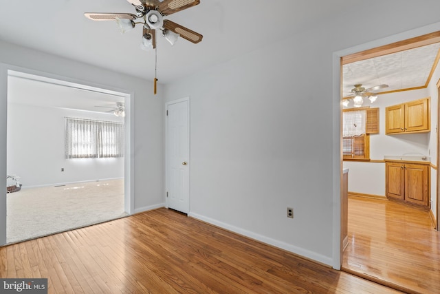 unfurnished bedroom featuring light wood-type flooring and baseboards