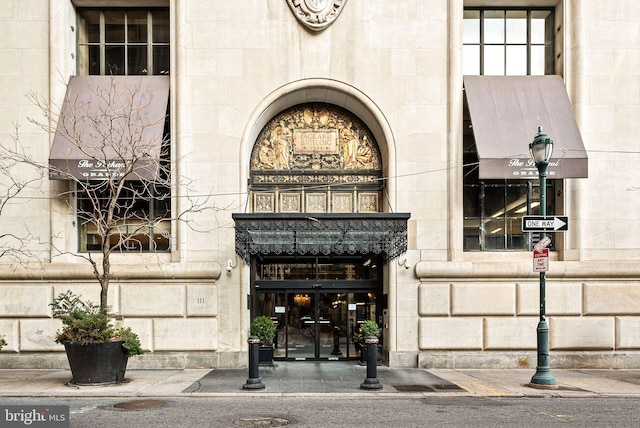 entrance to property featuring stone siding