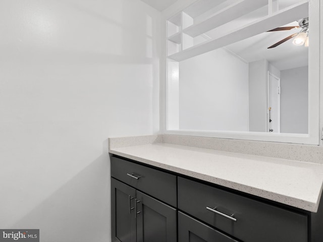 bathroom featuring a ceiling fan and vanity