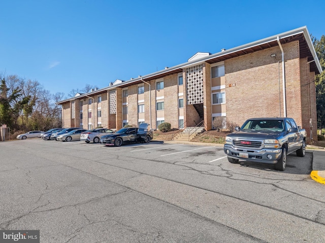 view of property with uncovered parking